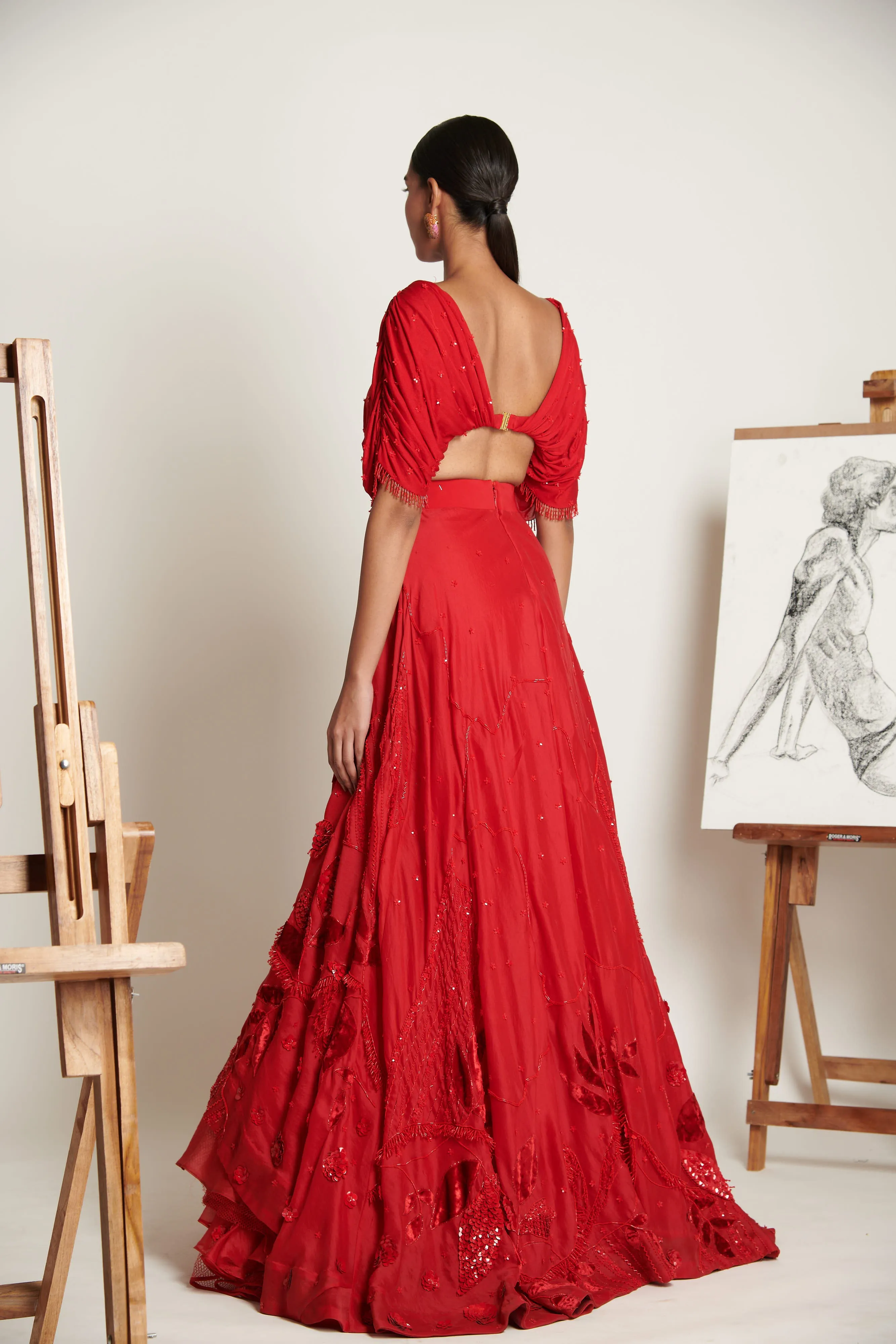 Ruby-Red Celestial Asymmetrical Lehenga with Ruched Tassel Blouse
